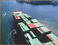 Photo of a cargo ship in a busy harbor.