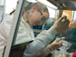 Photo of graduate student Mary-Catherine Leewis preparing a soil sample for testing.