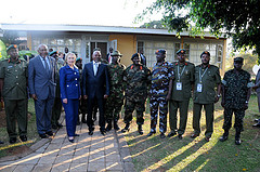 U.S. Secretary of State Hillary Rodham Clinton poses for a photograph with the U.S. Assistant Secretary of State for African Affairs Johnnie Carson and members of the Uganda People’s Defense Force (UPDF), at the UPDF's Kasenyi military base in Kampala, Ug