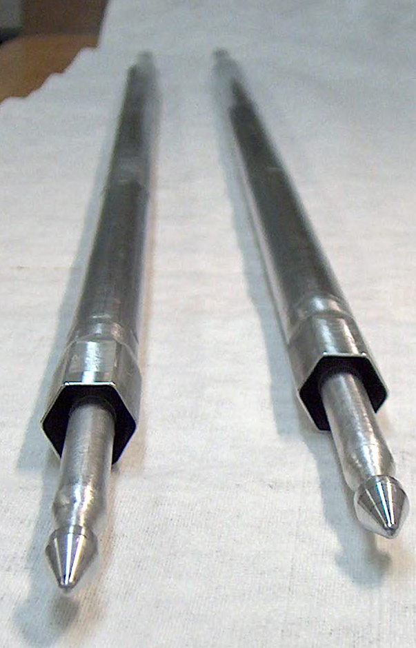 Targets of enriched stable <sup>62</sup>Ni such as these are bombarded them with neutrons in HFIR to make <sup>63</sup>Ni. Each target contains 25 grams of pressed <sup>62</sup>Ni metal pellets stacked in a 35 inch long aluminum target capsule, 12.5 grams at each end. 