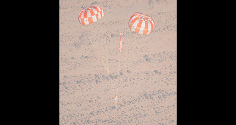 jsc2013e010454 -- NASA'S Orion Lands Safely on Two of Three Parachutes in Test