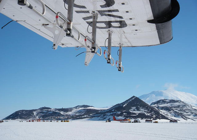 Closeup of airplane wing in a cold place.