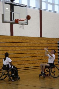 BG Gary Cheek (right) plays wheelchair basketball with Wounded Warriors at Walter Reed Army Medical Center.