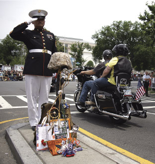 Staff Sgt. Tim Chambers saluting veterans during Rolling Thunder on Memorial Day 