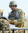 Staff Sgt. Brandon Tatum, joint terminal attack controller, 10th ASOS, prepares for JAAT training Aug. 22 at the Smoky Hill Air National Guard Training Range, Salina, Kan.  Photo by: Mollie Miller, 1ST INF. DIV.