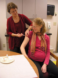 Photo: Pregnant woman getting a shot