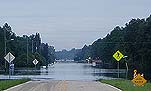 Big Slough Canal overflowing bridge and road at Tropicaire Boulevard  near North Port, June 24.