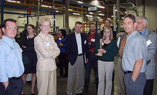 Participants visiting the new facility of Tyee Aircraft, a producer of aerospace components.  Tyee has incorporated sustainable principles into its lean manufacturing practices with zero waste water release, energy efficient lighting, and recycling programs.