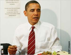 Barack Obama enjoys a burger