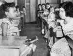 Black and white girls stare at each other in Fort Myer, Virginia school.