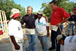 [Photo:  President Bush, Secretary Martinez, and two Habitat for Humanity participants]