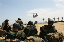 Marines with the Basic Reconnaissance Course, School of Infantry West, wait their turn to perform helocasting during one of the last performance evaluations, April 30. More than 60 Marines and sailors took turns jumping out of CH-46E "Sea Knight" helicopters assigned to Marine Medium Helicopter Squadron 165, Marine Aircraft Group 16, 3rd Marine Aircraft Wing.  (Official U.S. Marine Corps photo)(Released)