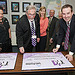 Signing on the dotted line. From left, Marcus Lucero of LANL Tech Transfer; John R. Grizz Deal, a founder of IX Power LLC; Kathleen McDonald of LANL Tech Transfer; Randall Wilson; a founder of IX Power LLC; Otis (Pete) Peterson, former LANL staff scientist and a founder of IX Power LLC; and David Pesiri, LANL Tech Transfer division leader.