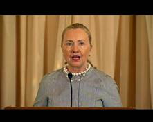 Woman speaking into microphone. (Photo Credit: Department of State)