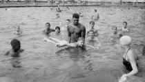 Lifeguard teaching boy to swim,Highland Park swimming pool 1951