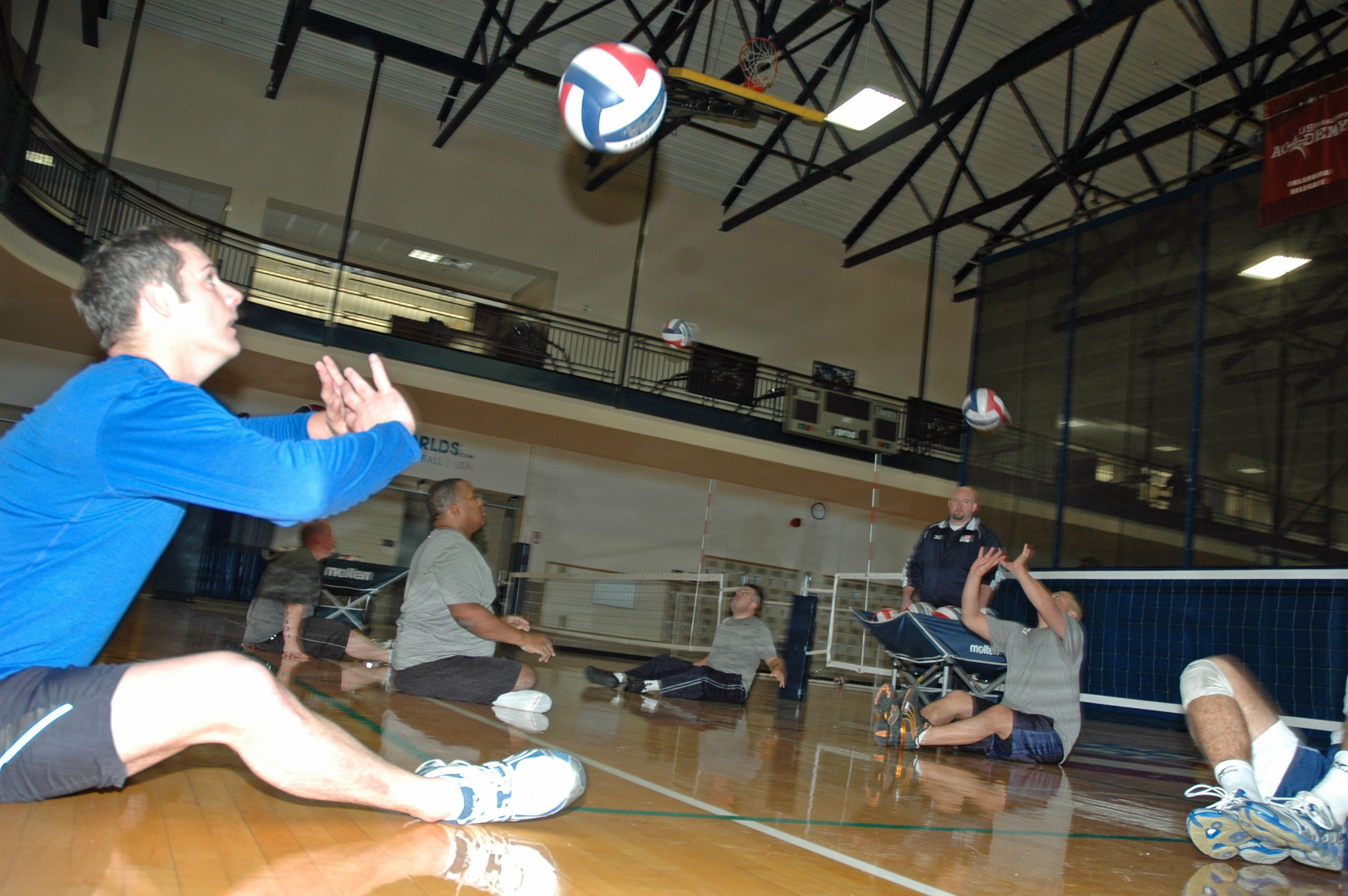 SFC Chris Livesay, Ft. Carson, CO, practices hitting a volleyball with other wounded warrior athletes during a sitting volleball training clinic held at the University of Central Oklahoma.