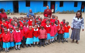 Lillian Alwi leads students in song at the Ongata Pine Breeze Academy outside Nairobi, Kenya.