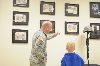 The “Diehard Memorial Wall” is open to all Soldiers and family members. Lt. Col. Kirk E. Gibbs encourages visitation and says it is a place for him to “reflect and draw inspiration.”  CPT (CH) Jason Hill explains to his son Matthew the meaning and significance of the names on the wall. 