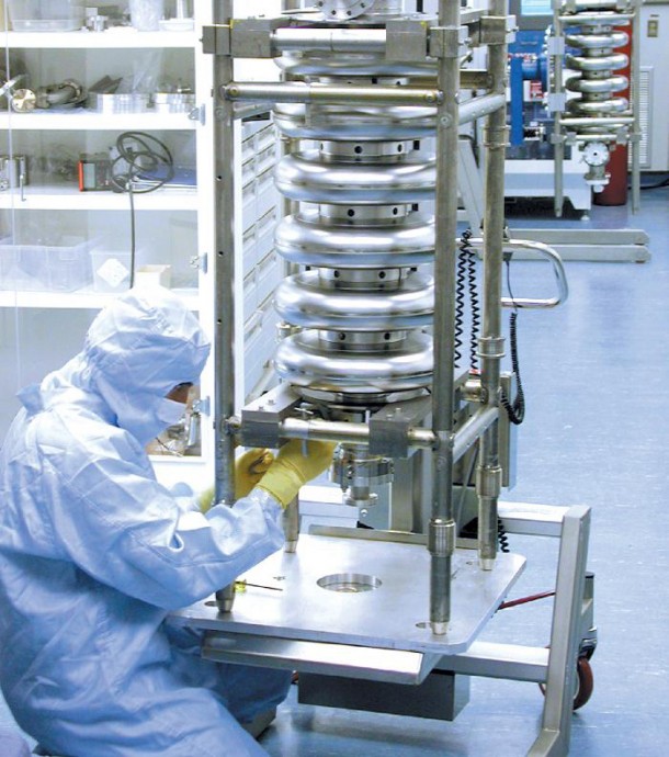 This is a Spallation Neutron Source cavity assembly in the clean room the Thomas Jefferson National Accelerator Facility in Virginia. It's a piece of a particle accelerator that scientists use to provide the most intense pulsed neutron beams in the world.  (Photo: Jefferson Lab)