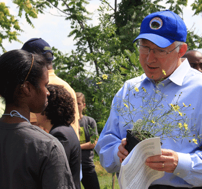 A photo of Secretary of the Interior chats with an  area student during an event along the Patapsco River in Baltimore. Photo by Pablo Miranda