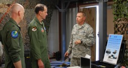 Master Sgt. Timothy Maczuga (right), 290 JCSS Flight NCOIC, briefs Lt. Gen. Stanley Clarke (center) and Brig. Gen. James Eifert on the capabilities of the Initial Entry Package (IEP) at the 290 JCSS, MacDill AFB, Fla. Photo by Senior Master Sgt. Richard Dautzenberg