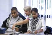 Teacher working with two students