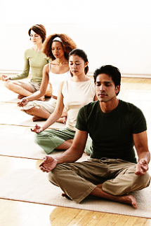People meditating in a class environment