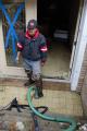 Pumping Out Water in Flooded Home