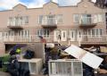 Debris piles up outside of residents impacted by Hurricane Sandy