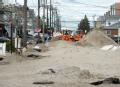 Local crews clear streets of sand from Hurricane Sandy