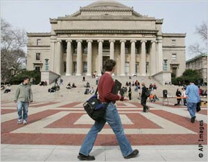 Students walking in front of classical Columbia University building (AP Images)