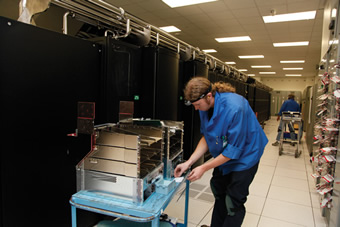 A Cray technician prepares to upgrade nodes on the Jaguar supercomputer. Photo: Jason Richards