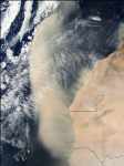 A large Saharan dust storm leaves the West African coast to move over the Atlantic Ocean and cover downwind islands. 