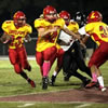 Lejeune High School's running back Jamaz Richardson runs the ball to the outside as fullback Stephen Dicenso looks for a defensive player to block against the Pamlico County High School Hurricanes during Lejeune High's homecoming game aboard Marine Corps Base Camp Lejeune Friday.<br />