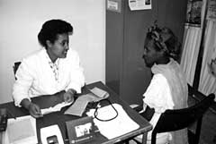 Photo of health worker counseling a woman at an Ethiopian health clinic.