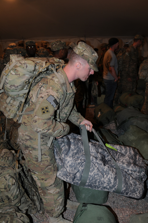 Soldier securing his bag from the parking lot