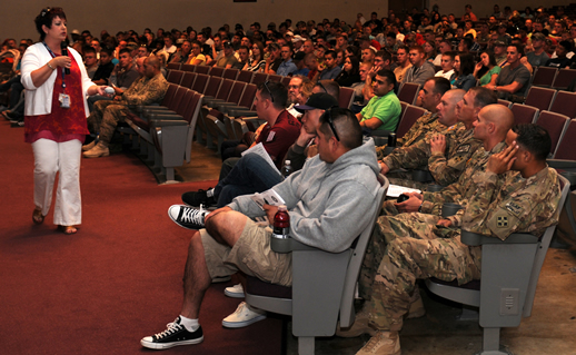 Woman giving speech in auditorium