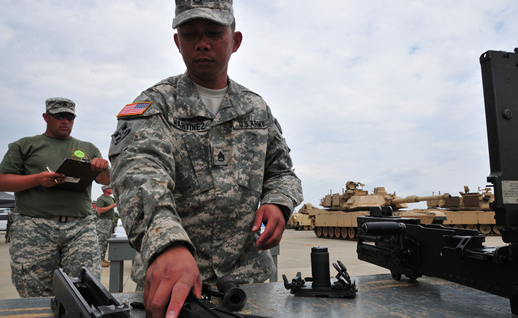 Soldier assembling a .50 caliber weapon