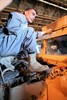 HABBINIYAH, Iraq (March 10, 2007) - An Iraqi student stands on top of a humvee engine during the Iraqi army?s Wheeled Vehicles Mechanics Course here March 7. The course is taught by senior Iraqi mechanics and civilian contractors to soldiers of the 1st Motor Transportation Regiment, 1st Iraqi Army Division. It teaches them everything they need to know to fix the vehicles used by the growing Iraqi fighting force. Photo by Cpl. Wayne Edmiston, 2nd Marine Logistics Group.