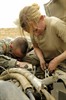 AS SADAH, Iraq (April 16, 2007) - U.S. Army Sgt. Michael Holeman (left) and Spc. Amy Rodgers dive into their work as they perform maintenance on a vehicle at a patrol base in As Sadah, Iraq, on April 6, 2007. Both soldiers are from Charlie Troop, 5th Squadron, 73rd Cavalry Regiment (Airborne Recon), 3rd Brigade Combat Team, 82nd Airborne Division, deployed from Fort Bragg, N.C. Photo by Staff Sgt. JoAnn S. Makinano, U.S. Air Force.