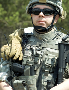 Active duty servicemember in combat uniform.