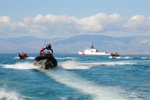 A small boat with crewmembers from the CGC Mohawk races to shore with supplies and personnel to aid in the response to the earthquake that struck Haiti last week. (U.S. Coast Guard photo by FN Rebekah Runner)