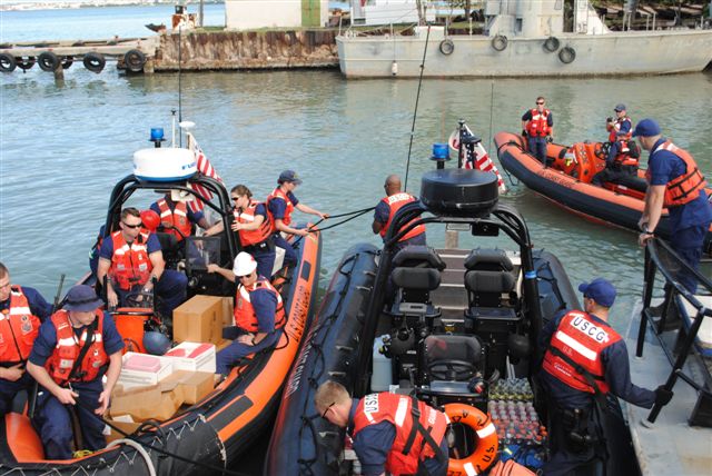 Crewmembers from CGC Mohawk lash up an prepare to unload much needed supplies - medical and water - in the harbor at Port-Au-Prince. (U.S. Coast Guard photo by FN Rebekah Runner)