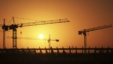 Cranes operate at the site of the football stadium in Benghazi, Libya, Jan. 19, 2013.