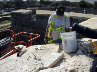 Workers repairing a fort wall