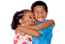 Two children hug