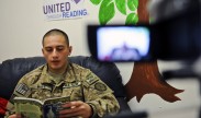 U.S. Navy Hospital Corpsman Brian Mays, a medic assigned to Provincial Reconstruction Team Farah, reads a book as part of a United Through Reading Read-a-thon on Forward Operating Base Farah, Afghanistan, Jan. 18, 2013. U.S. Navy photo by Lt. j.g. Matthew Stroup