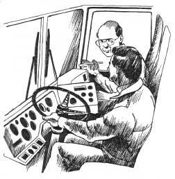 Truck driver receiving training from a supervisor in the passenger seat.