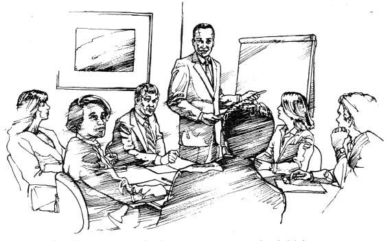 People attending a meeting with a white board