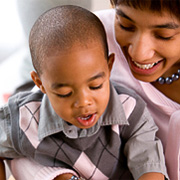 A woman holding a young boy